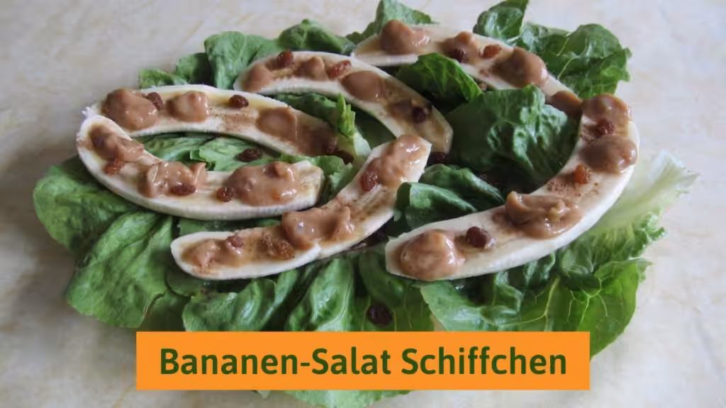 Bananas smeared with date sauce on lettuce leaves