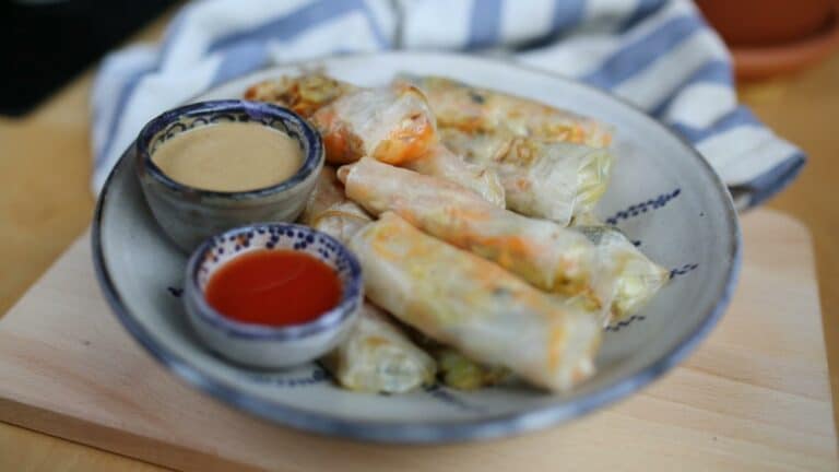 Spring rolls on plate with 2 sauces