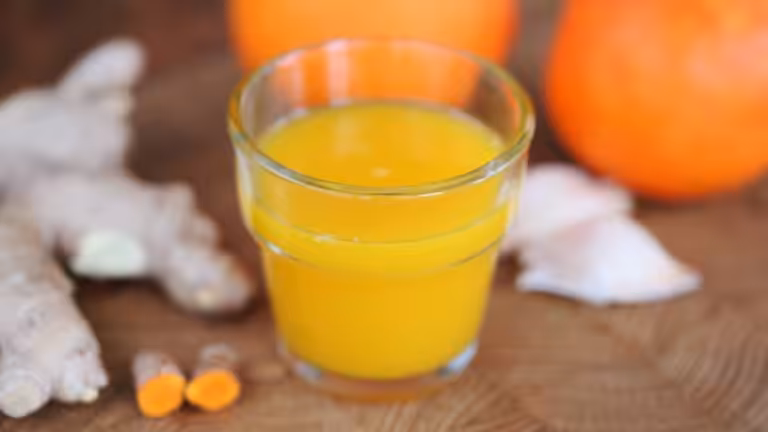 Glass with turmeric-ginger shots