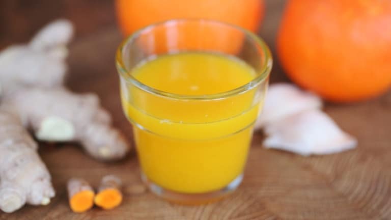 Glass with turmeric-ginger shots