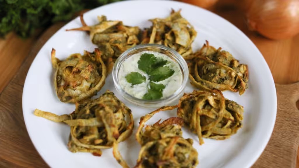 Plate with onion pakora and cashew dip